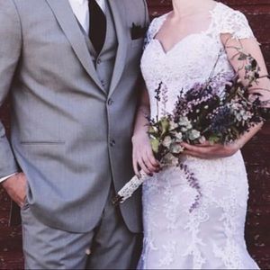 Beautiful NWOT blush lace wedding dress. Size 6.